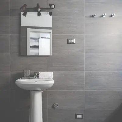 a bathroom with a white sink and a mirror at A World Aparts - 32 Calabria in Rome