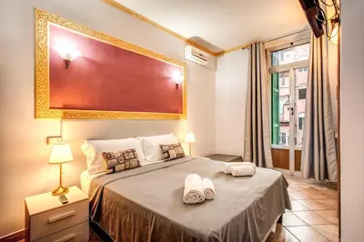 a bedroom with a bed with two towels on it at Beautiful Home in Rome