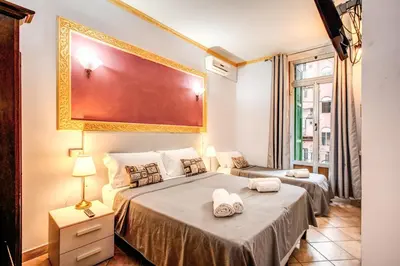 a bedroom with two beds and a large window at Beautiful Home in Rome