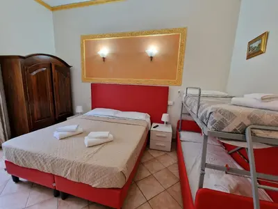 a bedroom with two bunk beds and a mirror at Beautiful Home in Rome