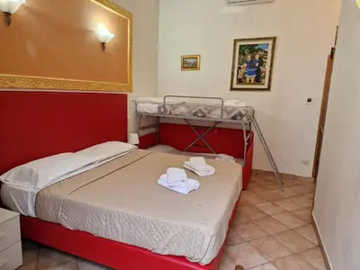 a bedroom with a bed with towels on it at Beautiful Home in Rome