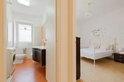 a white bathroom with a crib in a room at Roman Style I near San Pietro in Rome