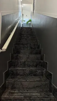 a staircase in a building with stone steps at San Paolo Guest House in Rome