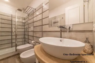 a bathroom with a white sink and a toilet at CS Exclusive Campo de Fiori Palace in Rome