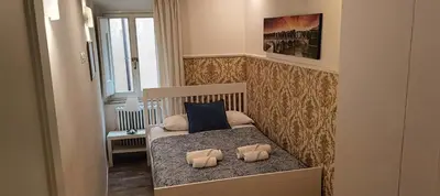 a small bedroom with a bed with two pillows on it at CS Exclusive Campo de Fiori Palace in Rome