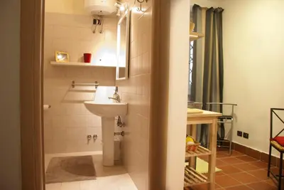 a bathroom with a sink and a shower at TRASTEVERE - STUDIO APT. x 2 in Rome