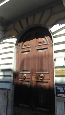 a large wooden door in a building at Esquilino Confort Roma in Rome