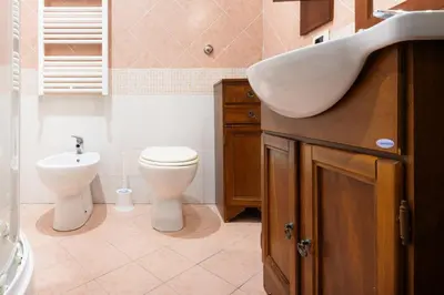 a bathroom with a sink and a toilet at Esquilino Confort Roma in Rome