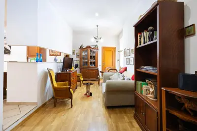 a living room with a couch and a desk at Esquilino Confort Roma in Rome