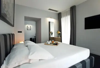 a large white bed in a hotel room at Suite Art Navona in Rome