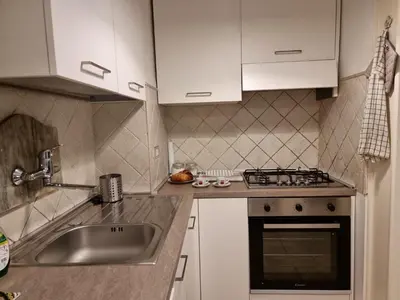 a kitchen with a sink and a stove at Pantheon, Campo de fiori mini garden in Rome