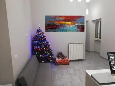 a christmas tree in a living room with a couch at Garden's Elide in Rome