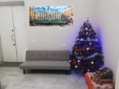 a living room with a christmas tree and a couch at Garden's Elide in Rome