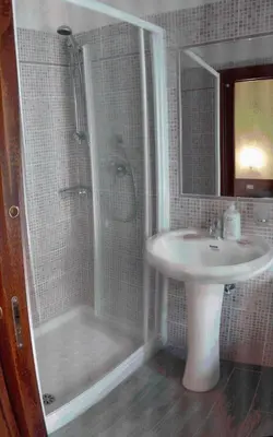 a bathroom with a shower and a sink at Le Terrazze Del Vaticano in Rome