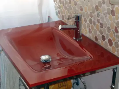 a red sink with a red faucet on a counter at Le Terrazze Del Vaticano in Rome