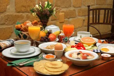 a table with breakfast foods and drinks on it at Le Terrazze Del Vaticano in Rome