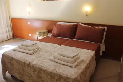a bedroom with a bed with towels on it at Le Terrazze Del Vaticano in Rome