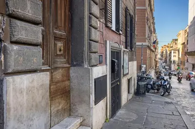 an alley with motorcycles parked on a city street at Gh Trevi Fountain in Rome