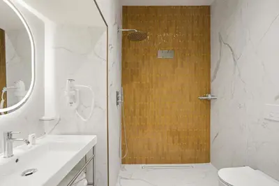 a bathroom with a shower and a sink and a toilet at Gh Trevi Fountain in Rome