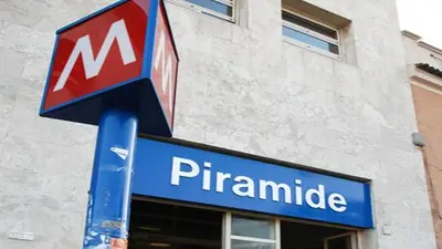 a pharmacy sign on a pole in front of a building at Ostiense Suites in Rome