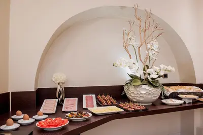 a table with a bunch of food on it at Demetra Hotel in Rome