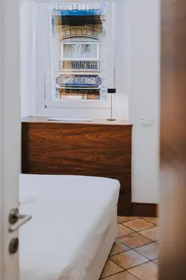 a small refrigerator with its door open in a kitchen at Albergo Delle Regioni, Barberini - Fontana di Trevi in Rome