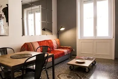 a living room with a couch and a table at Appart in Rome