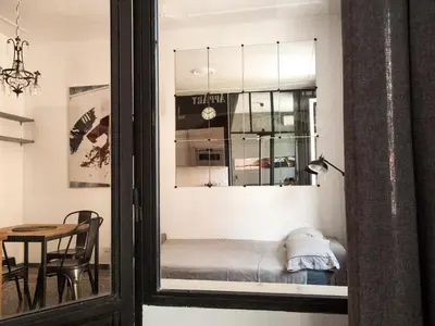 a room with a window with a bed in it at Appart in Rome