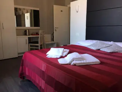 a bedroom with two beds with towels on them at Morfeo Suite in Rome