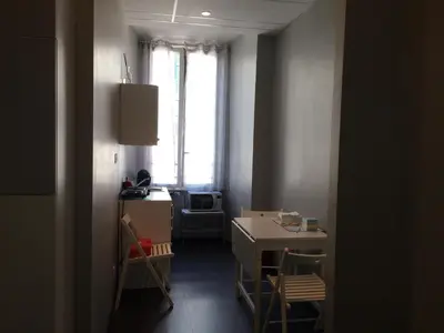 a room with a desk and a window and a table at Morfeo Suite in Rome