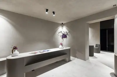 a room with a table with flowers on it at Elysium Suites collection in Rome