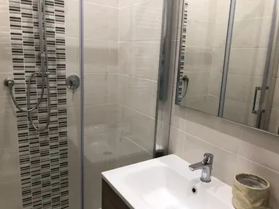 a bathroom with a sink and a shower at S.Apollonia Suite Trastevere in Rome