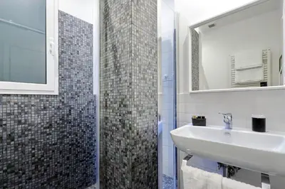 a bathroom with a sink and a mirror at Victory Rooms in Rome
