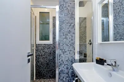 a bathroom with a sink and a shower at Victory Rooms in Rome