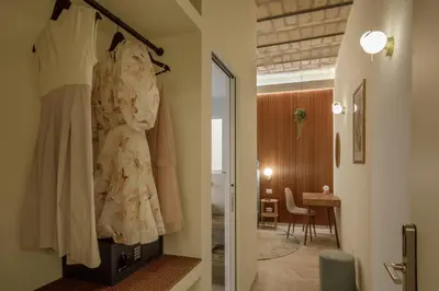 a dress hanging on a rack in a room at Rome for Two in Rome