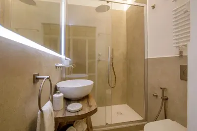 a bathroom with a shower and a sink and a toilet at Rome for Two in Rome