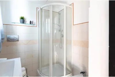 a shower with a glass door in a bathroom at PantheonDreamSuite in Rome