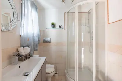 a bathroom with a shower and a toilet and a sink at PantheonDreamSuite in Rome