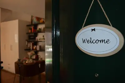 a welcome sign hanging on a door in a room at PantheonDreamSuite in Rome