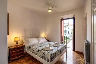 a bedroom with a bed and a glass table at Campo di Fiori 2 bedroom Via Giulia in Rome