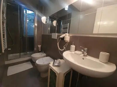 a bathroom with a sink and a toilet at Sweet Home Parioli in Rome