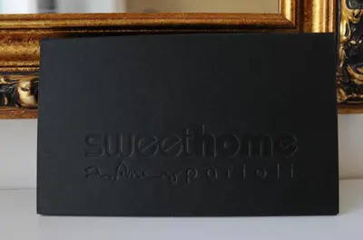 a room with a bench and a picture on the wall at Sweet Home Parioli in Rome