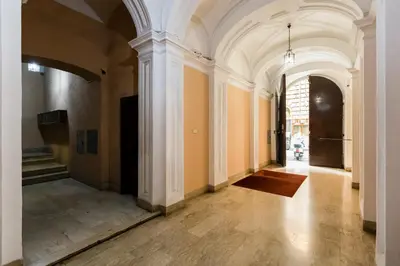 an empty hallway of a building with a white ceiling at Repubblica Exclusive Apartment in Rome