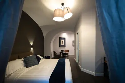 a bedroom with a large bed in a room at Lungotevere Ripa in Rome