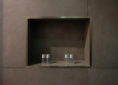 a mirror in a bathroom with three drinking glasses at Lungotevere Ripa in Rome