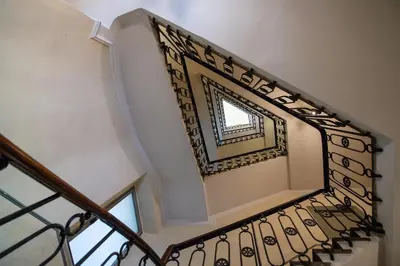 a stair case with a mirror on the top of it at Lungotevere Ripa in Rome