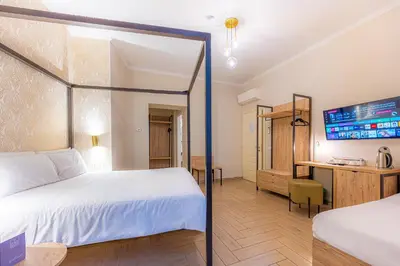 a hallway with large windows and a table in a room at Four Rivers Suites in Rome
