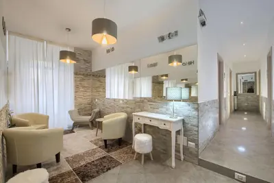 a living room with a table and chairs and a counter at Vatican Treasure in Rome