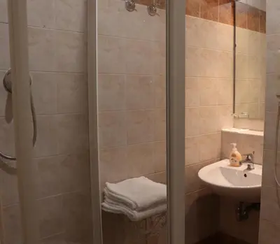 a bathroom with a shower and a sink at The Center Of Rome B&B in Rome