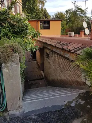 a stairway leading up to a brick building at FL Apartments Il piccolo borgo di Trastevere in Rome